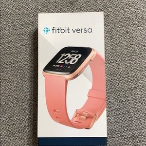 Fitbit versa (first generation) with accessories